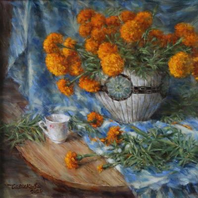 Still life of marigold flowers with a small white cup.  Feb. 2020