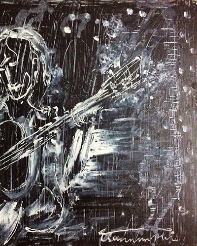 Guitarist giữa phố đêm mưa